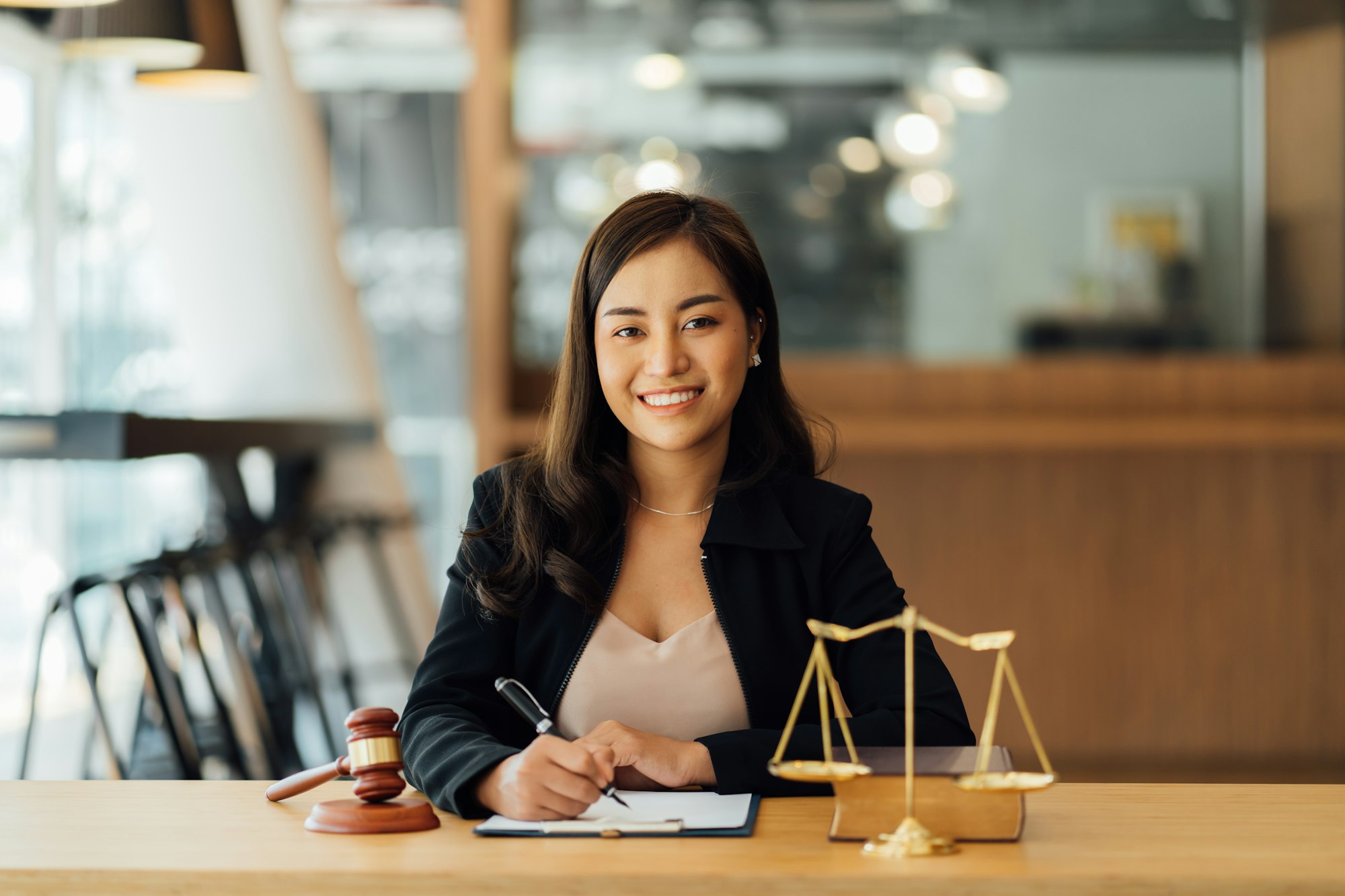 Lawyer business women working and writting in notebook on desk at office. consultant lawyer